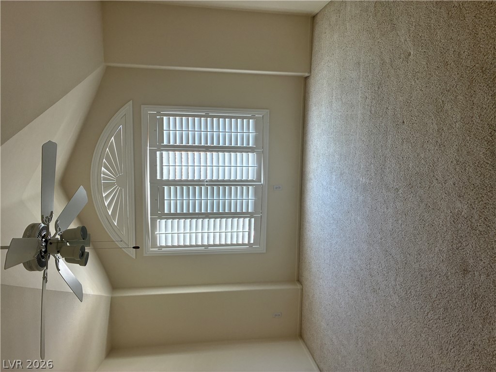 5272 Island Chain Road Las Vegas, NV 89118 - Photo 24 of 39 Sun-filled room with elegant window shutters and a functional ceiling fan.