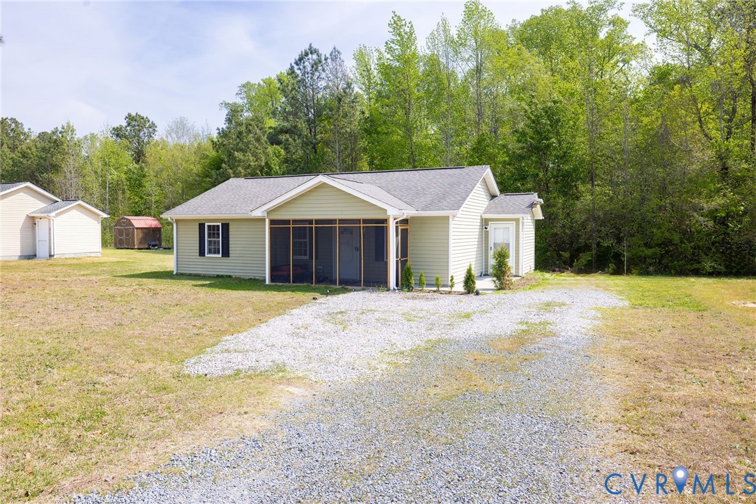 460 Horseshoe Road Jarratt, VA 23867 - Photo 1 of 24 a house with trees in the background