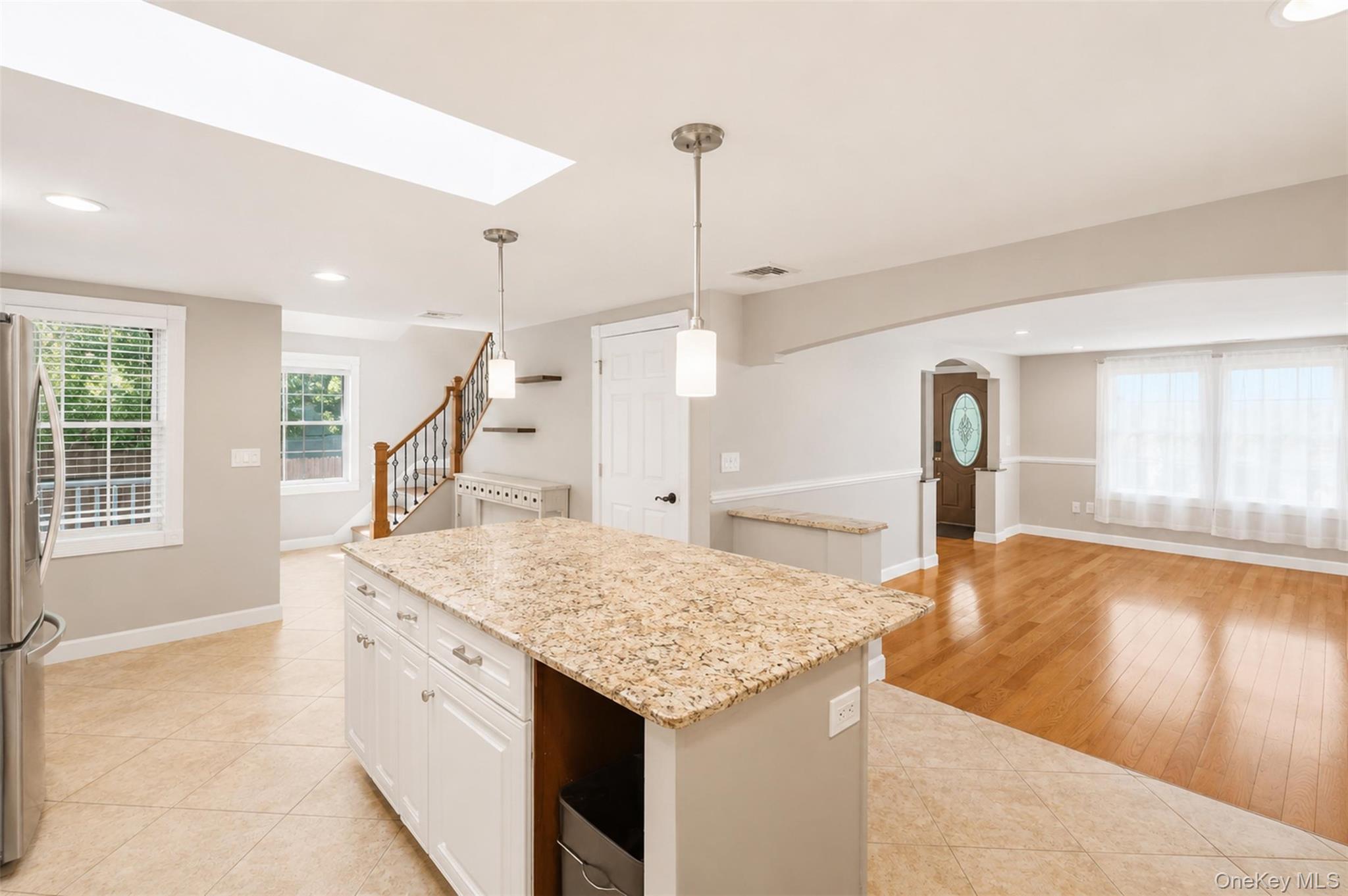 12 Leeside Road Carmel, NY 10512 - Photo 9 of 44 Central kitchen island with a light-toned granite countertop and white cabinetry