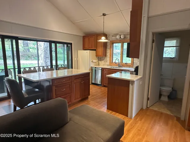 a view of an empty room with a large window