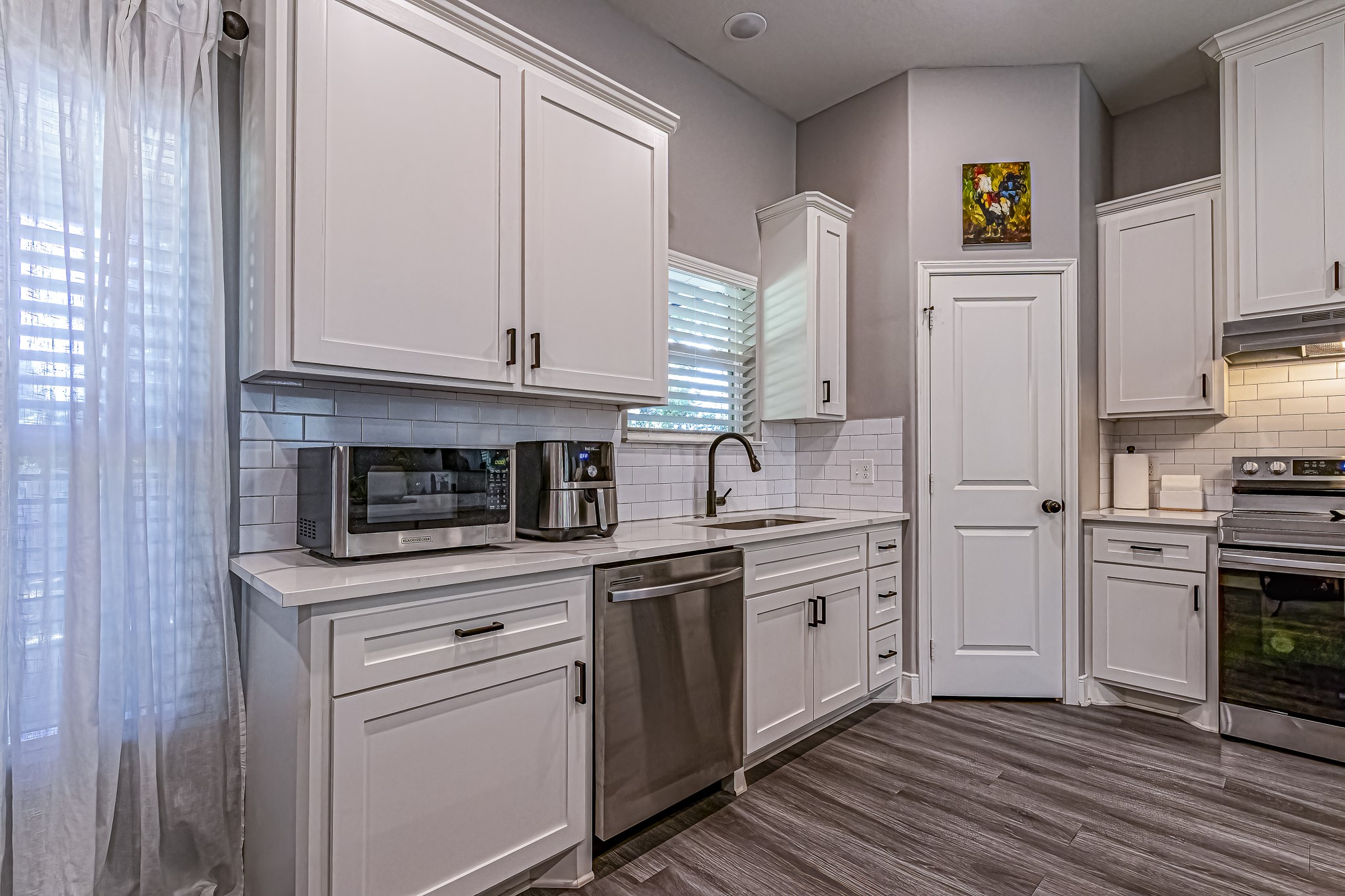 40 Bob Steele Road Coldspring, TX 77331 - Photo 13 of 50 a kitchen with stainless steel appliances granite countertop a stove a sink and a refrigerator