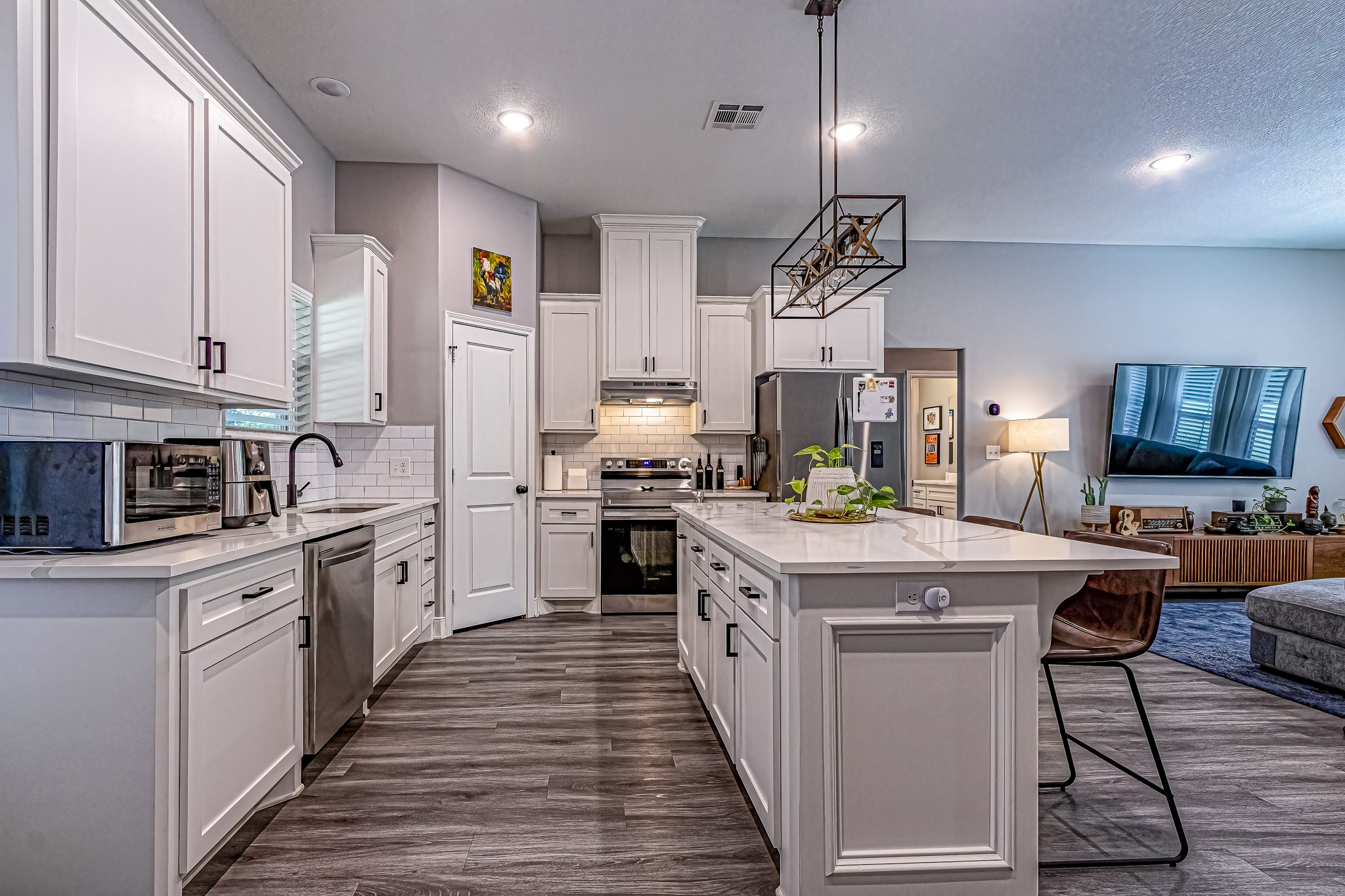40 Bob Steele Road Coldspring, TX 77331 - Photo 14 of 50 a kitchen with stainless steel appliances granite countertop a stove top oven a sink dishwasher and a refrigerator