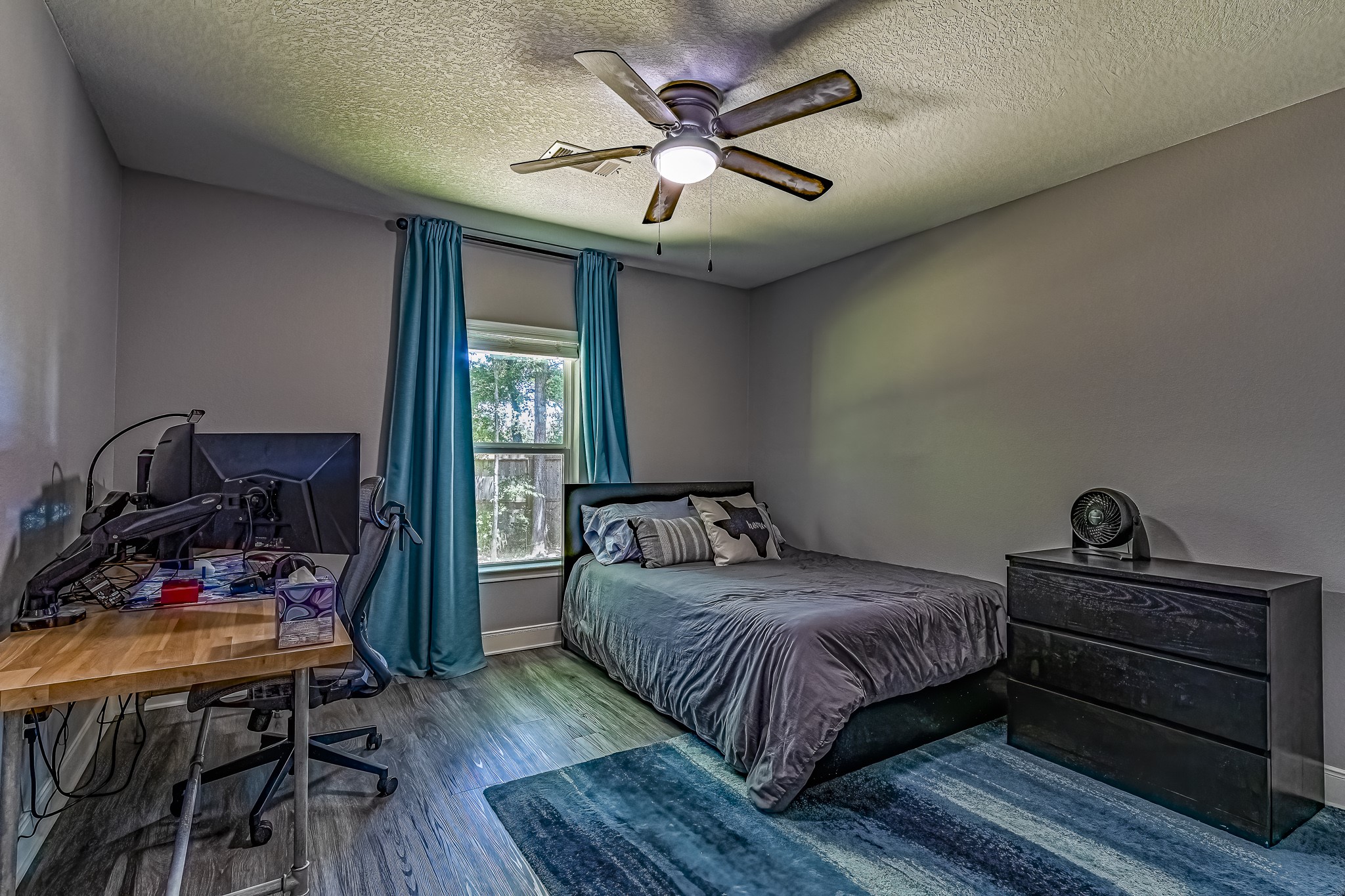 40 Bob Steele Road Coldspring, TX 77331 - Photo 25 of 50 a bedroom with a bed and wooden floor