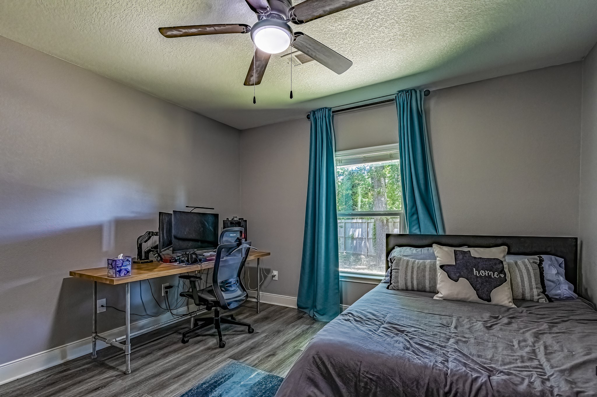 40 Bob Steele Road Coldspring, TX 77331 - Photo 26 of 50 a bedroom with a bed and a window