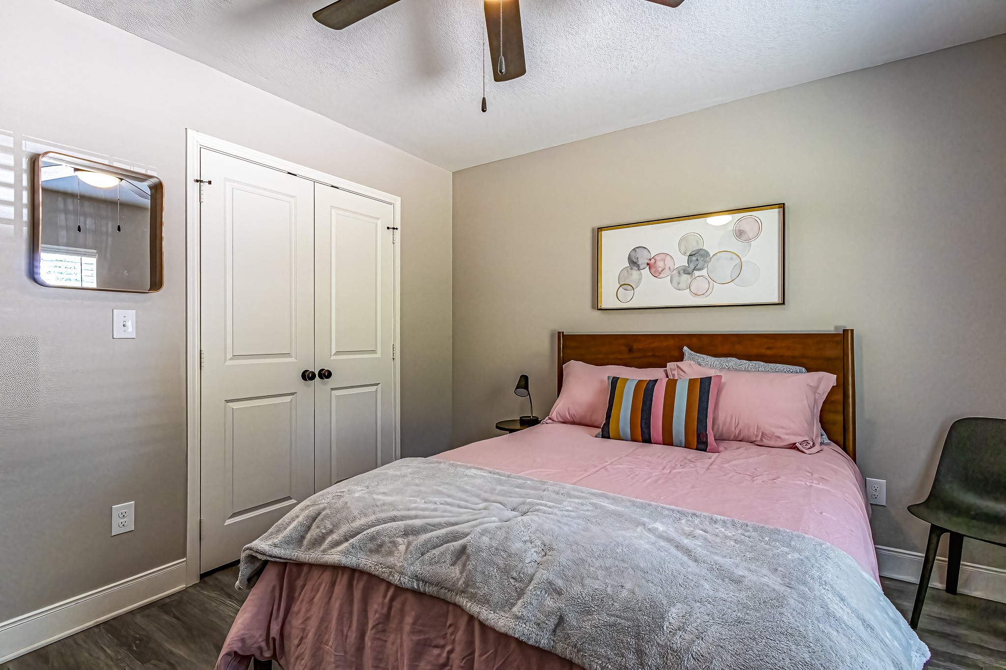 40 Bob Steele Road Coldspring, TX 77331 - Photo 30 of 50 a bedroom with a large bed and a chandelier