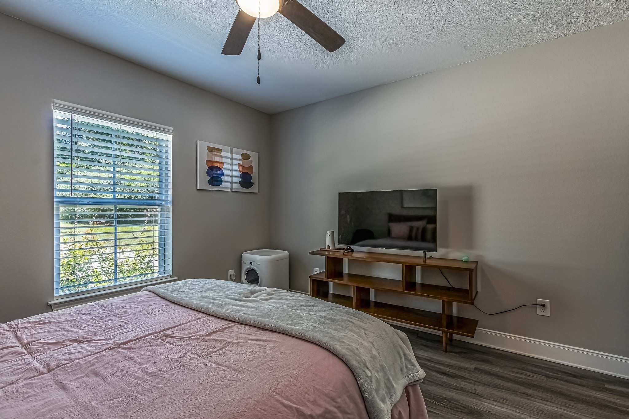 40 Bob Steele Road Coldspring, TX 77331 - Photo 31 of 50 a bedroom with a bed and a flat screen tv