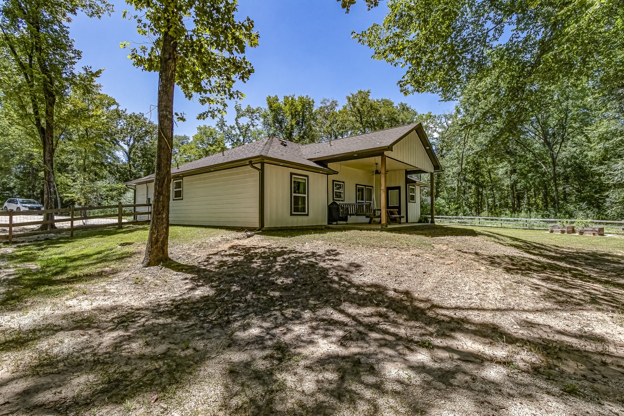 40 Bob Steele Road Coldspring, TX 77331 - Photo 37 of 50 a house with trees in the background