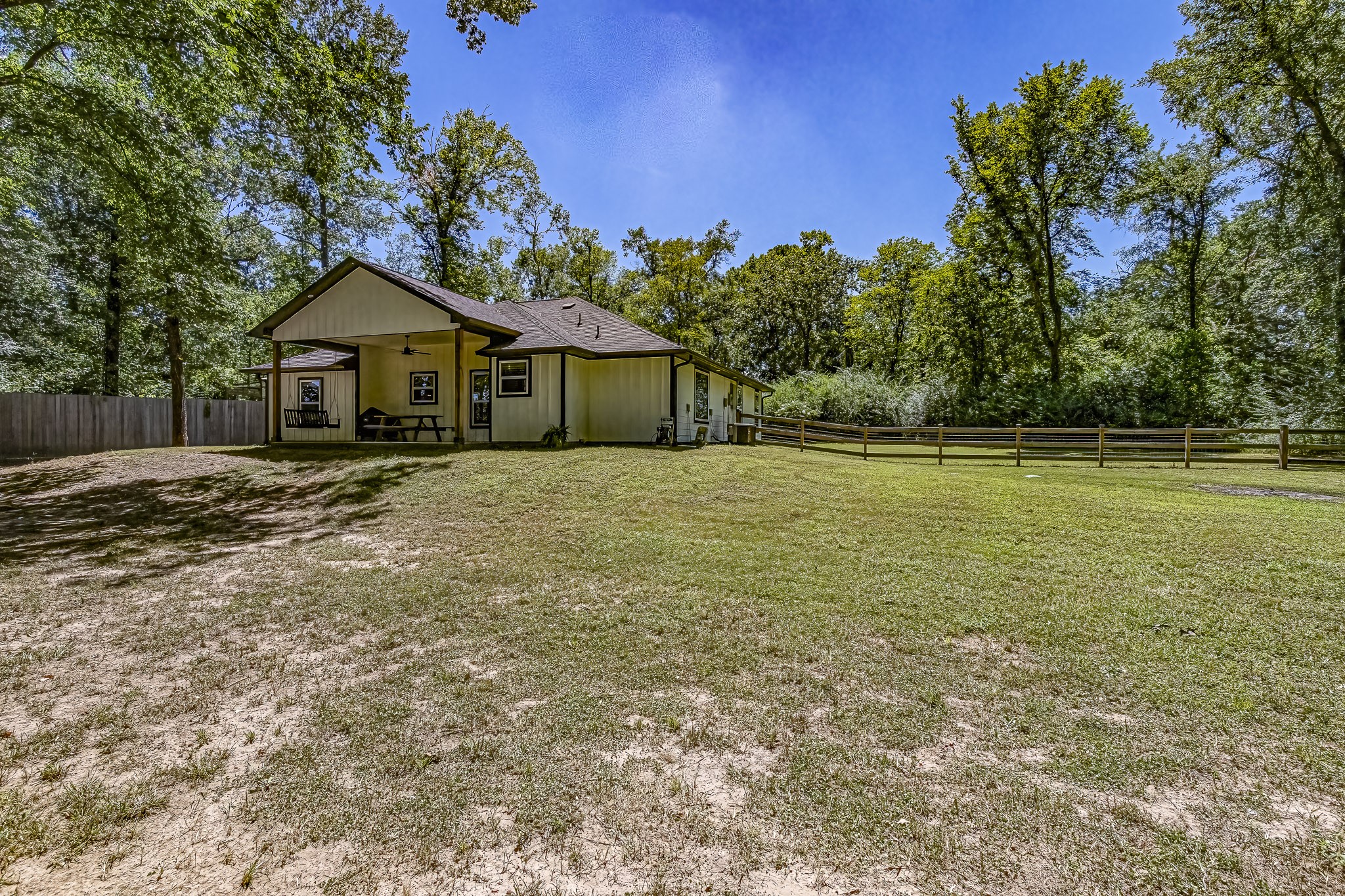 40 Bob Steele Road Coldspring, TX 77331 - Photo 42 of 50 a front view of a house with a yard and trees