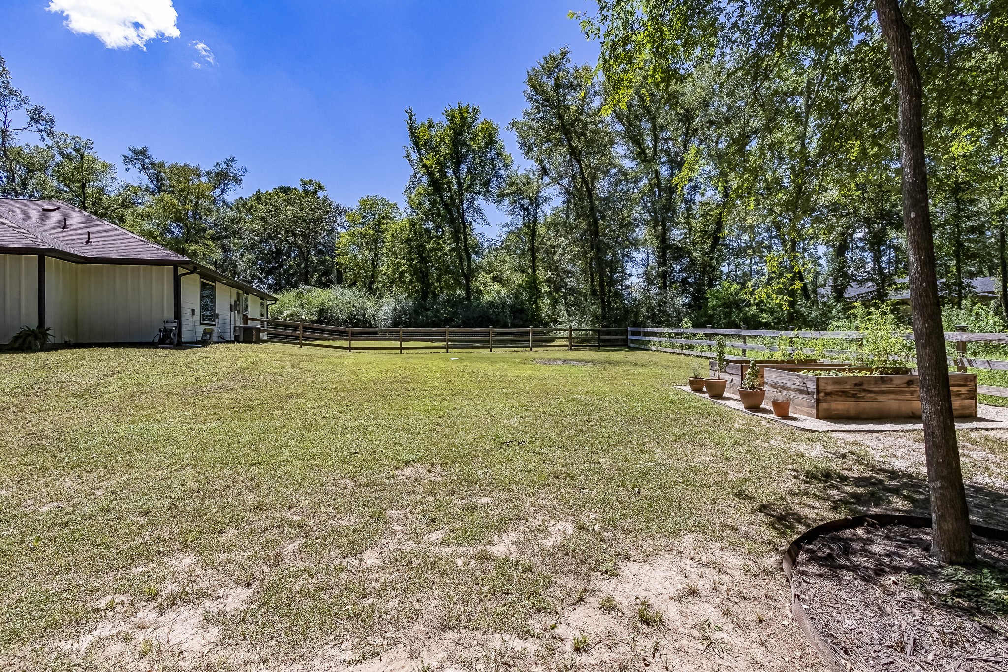 40 Bob Steele Road Coldspring, TX 77331 - Photo 43 of 50 a view of a lake with a yard