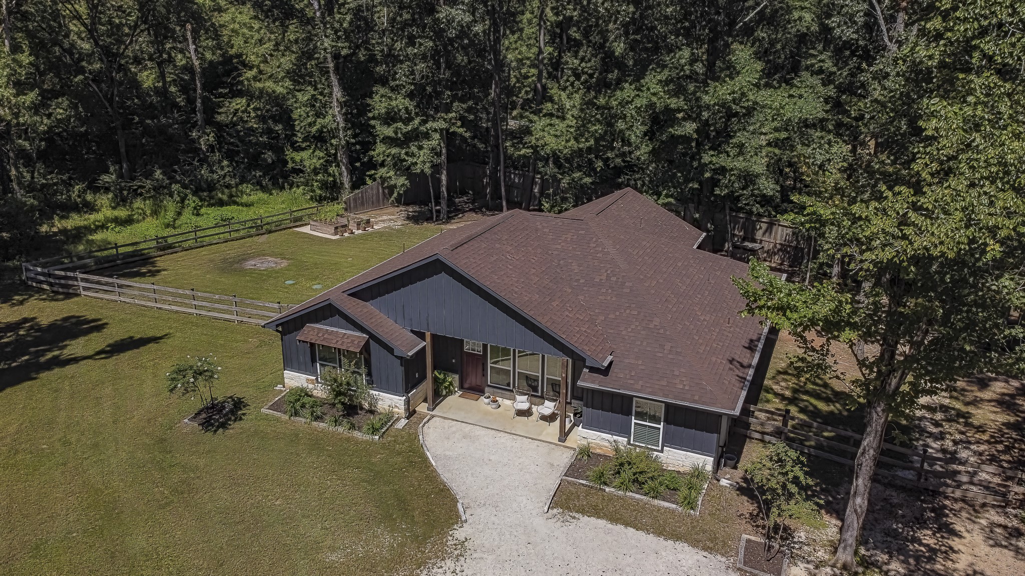 40 Bob Steele Road Coldspring, TX 77331 - Photo 47 of 50 an aerial view of a house with a yard basket ball court and outdoor seating