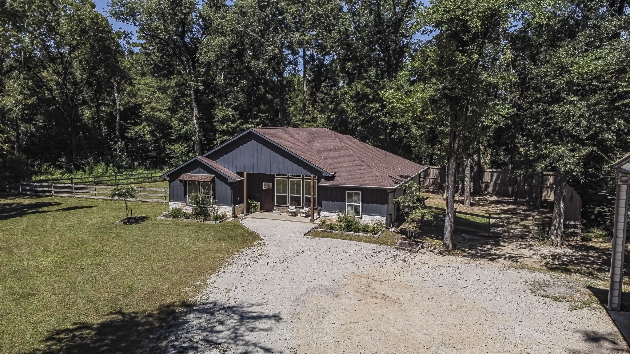 40 Bob Steele Road Coldspring, TX 77331 - Photo 48 of 50 a yellow and red house with a outdoor space