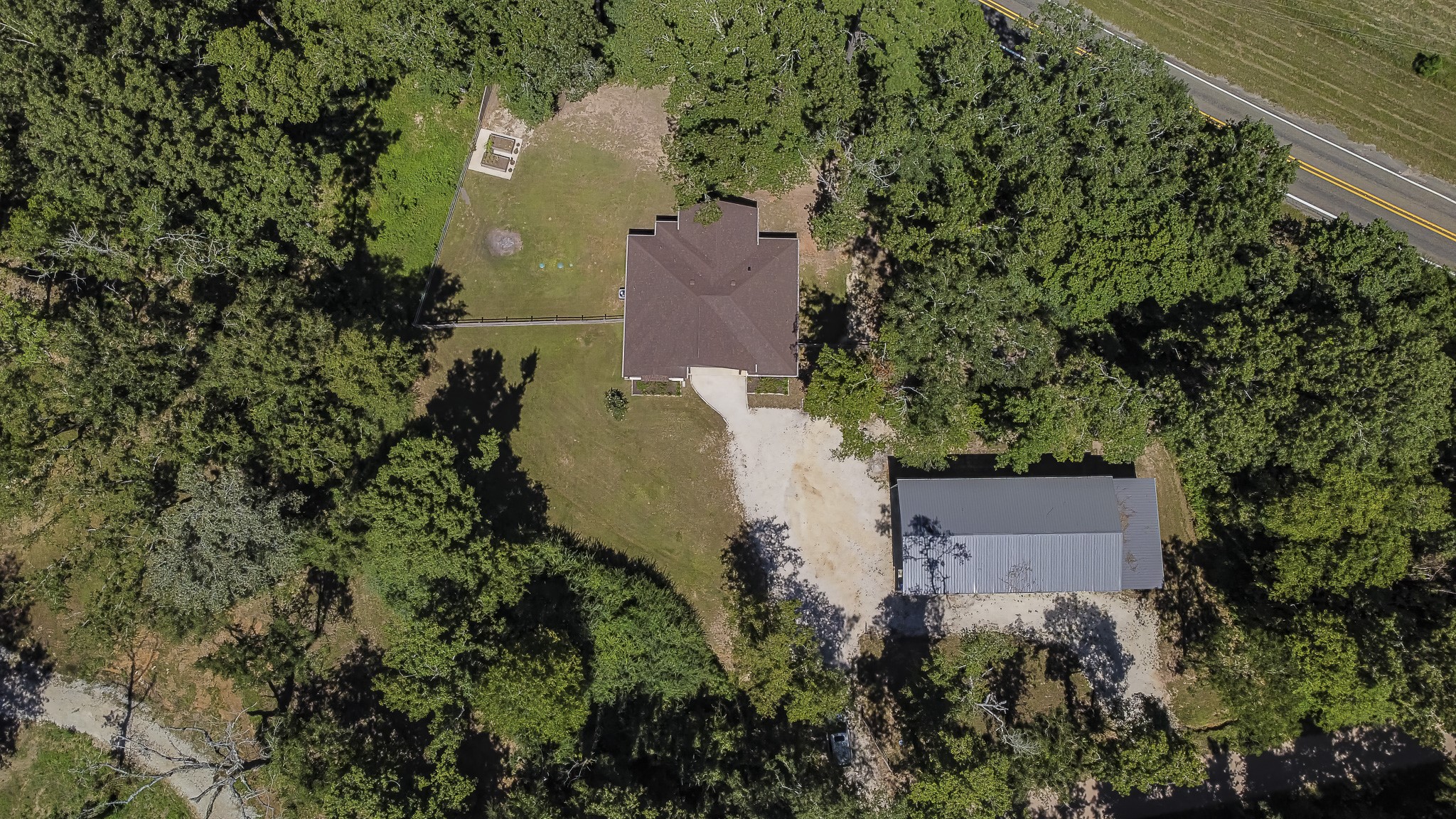 40 Bob Steele Road Coldspring, TX 77331 - Photo 4 of 50 an aerial view of a house with outdoor space and a lake view