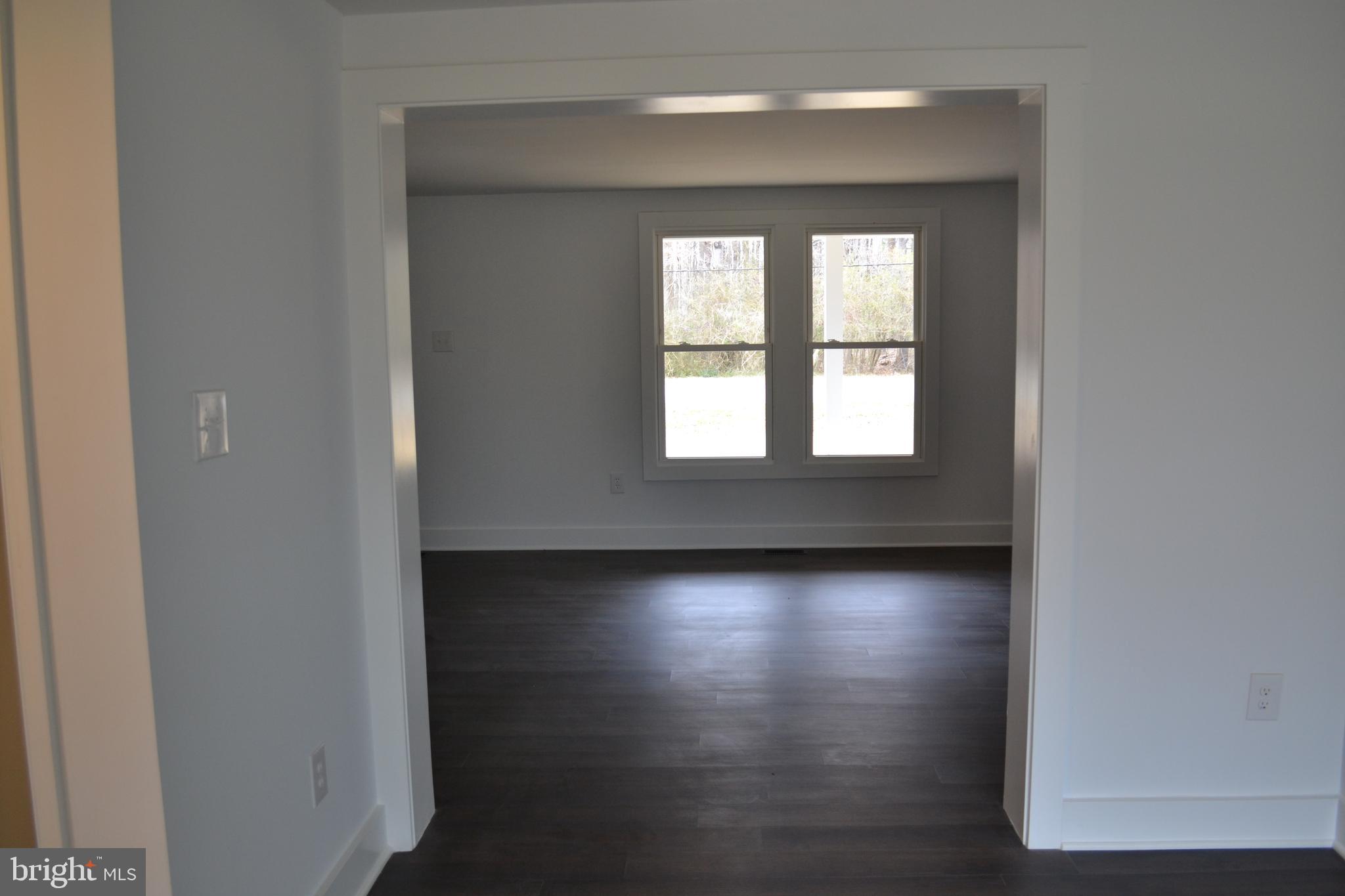 125 Cove Point Road Lusby, MD 20657 - Photo 14 of 32 View into living room from dining room