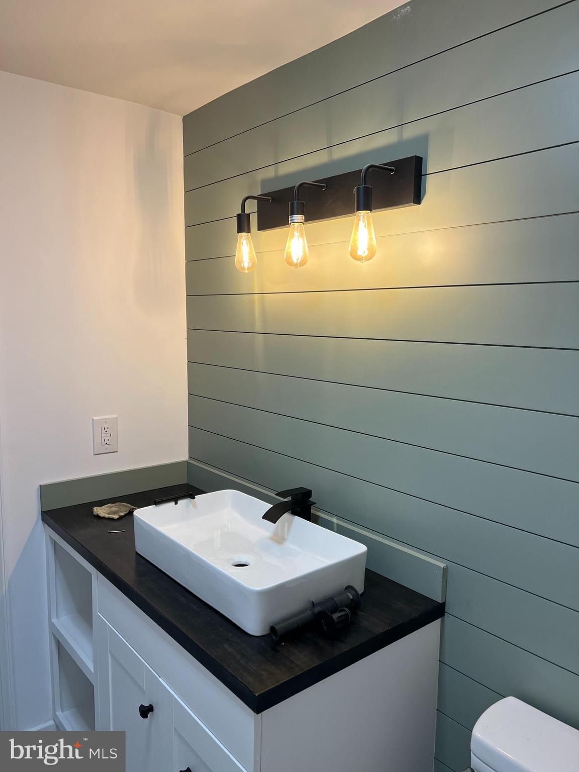 125 Cove Point Road Lusby, MD 20657 - Photo 22 of 32 Shiplap bathroom accent walls in both bathrooms
