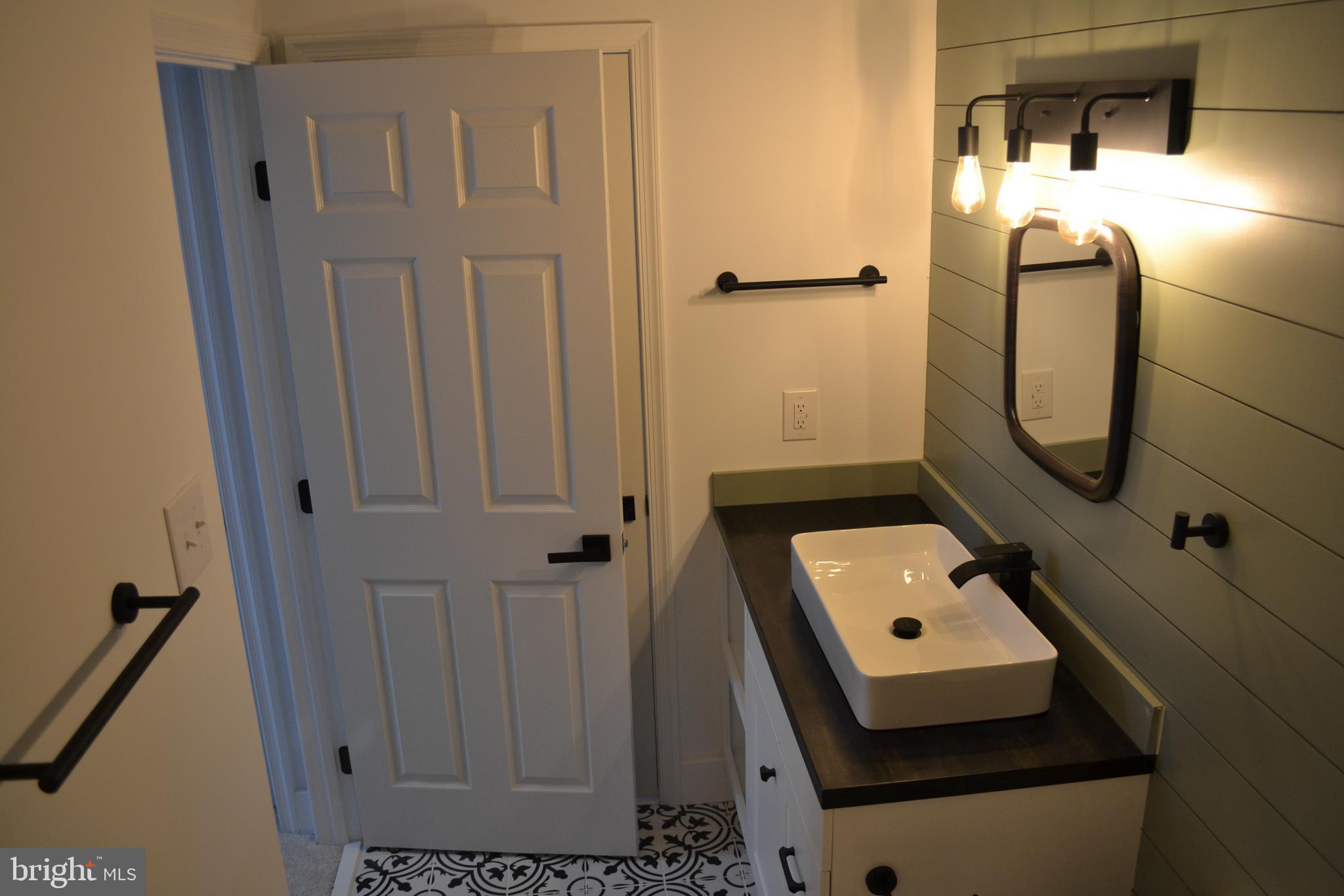 125 Cove Point Road Lusby, MD 20657 - Photo 28 of 32 Upper level full bath with butcher block vanity
