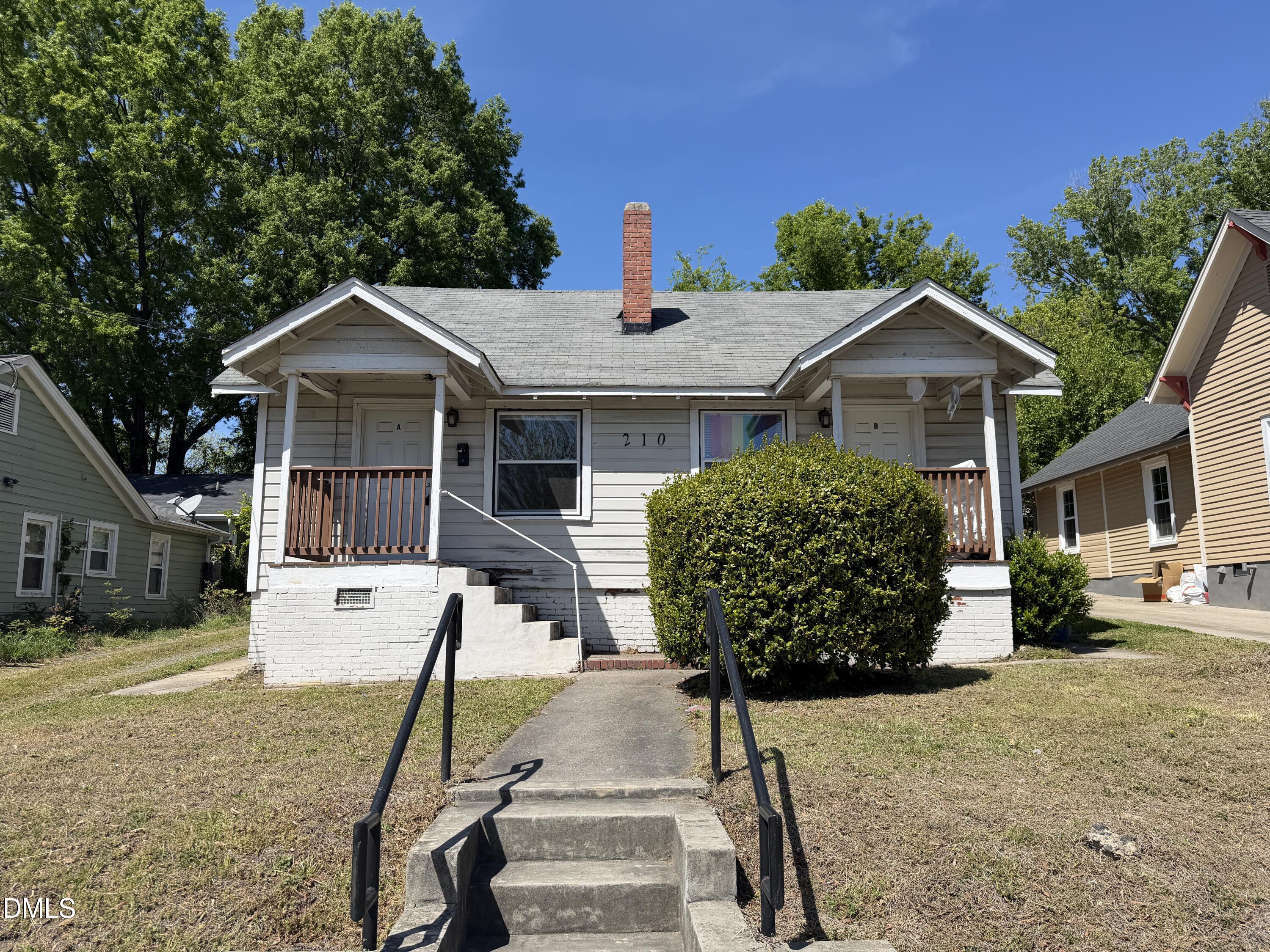 210 West Geer Street Durham, NC 27701 - Photo 3 of 15 a front view of a house with garden