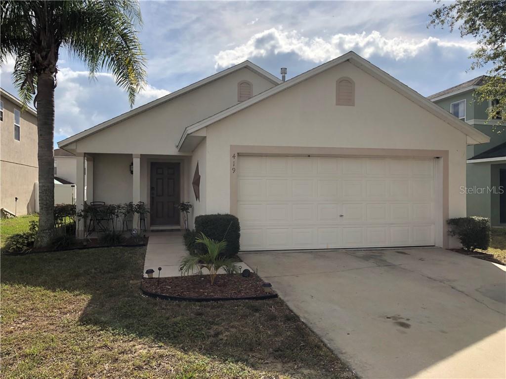 419 Rona Lane Davenport, FL 33897 - Photo 1 of 1 a front view of a house with garden