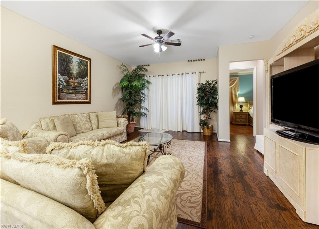 3641 Periwinkle Way Naples, FL 34114 - Photo 17 of 45 a living room with furniture and a flat screen tv