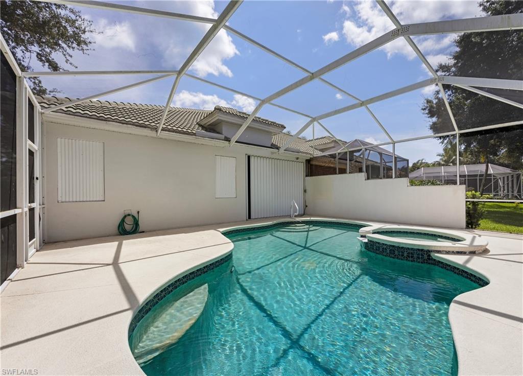 3641 Periwinkle Way Naples, FL 34114 - Photo 34 of 45 a bathroom with a sink and washing machine