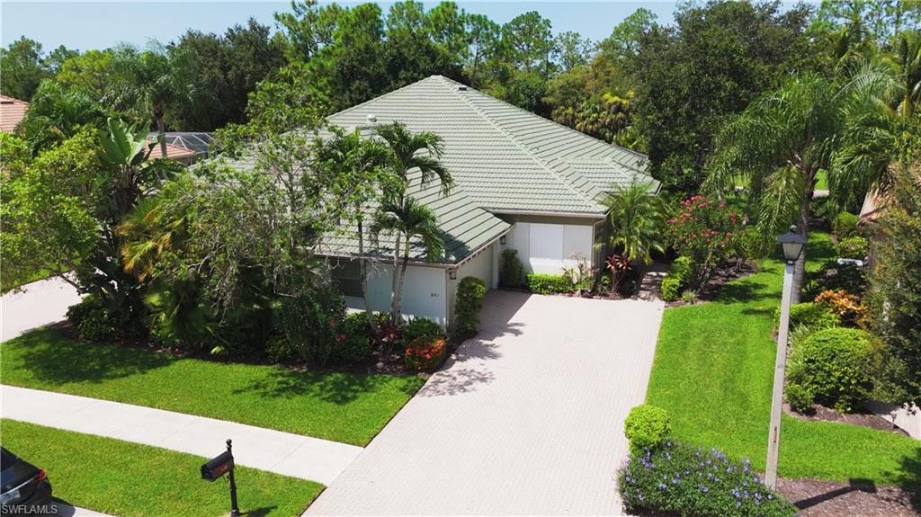 3641 Periwinkle Way Naples, FL 34114 - Photo 38 of 45 a view of a house with a yard and potted plants