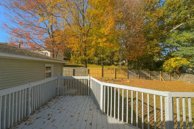 a view of a balcony with trees