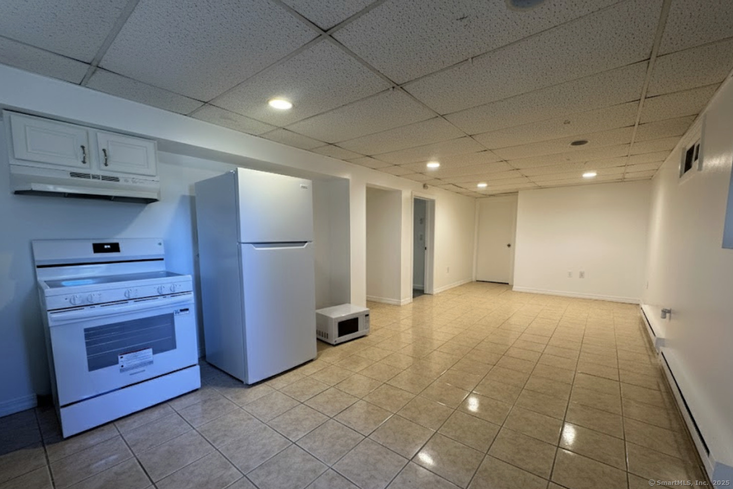 100 Media Avenue, Unit 1 Waterbury, CT 06708 - Photo 3 of 9 a view of an empty room and a kitchen