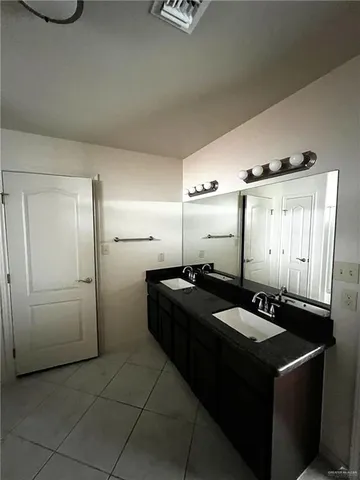 a kitchen with a sink and refrigerator