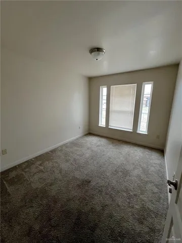 an empty room with a empty space and window
