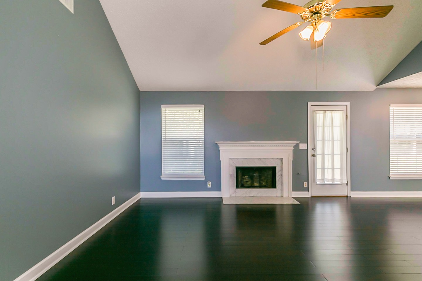409 Ashby Place Antioch, TN 37013 - Photo 11 of 26 an empty room with windows and fireplace