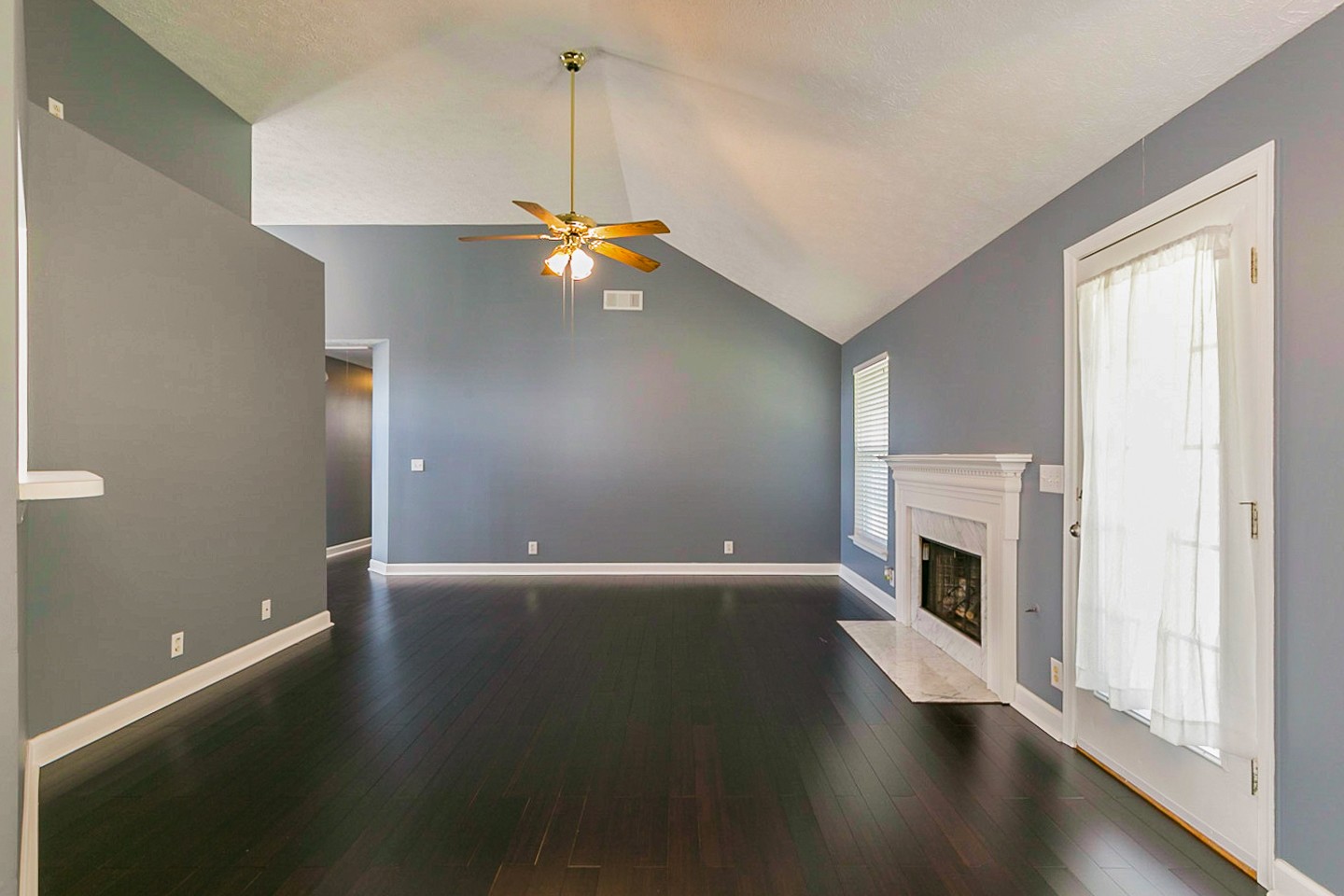 409 Ashby Place Antioch, TN 37013 - Photo 12 of 26 a view of an empty room with wooden floor and a window
