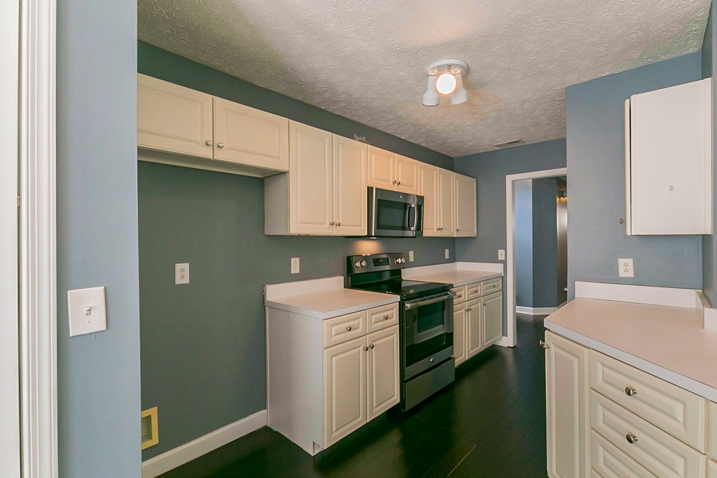 409 Ashby Place Antioch, TN 37013 - Photo 6 of 26 a kitchen with white cabinets and white appliances