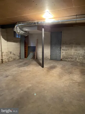 a view of an empty room with windows
