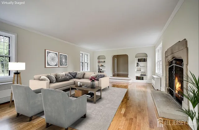 a living room with furniture and a fireplace