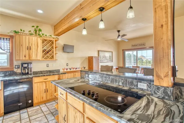 a kitchen with a stove a sink and a refrigerator