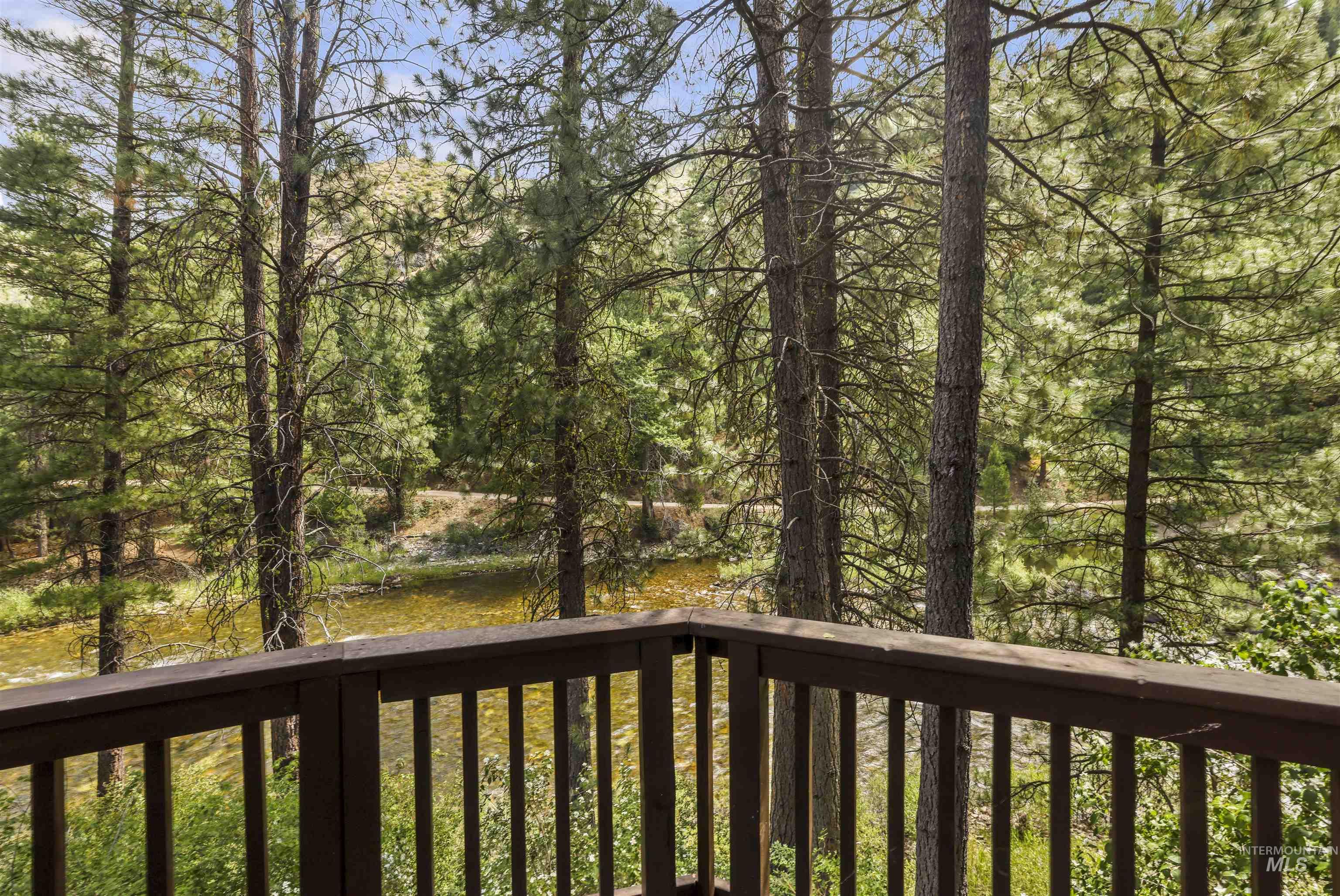 224 Dakota Road Mountain Home, ID 83647 - Photo 36 of 50 Outdoor balcony with dark wood railing overlooking a natural landscape