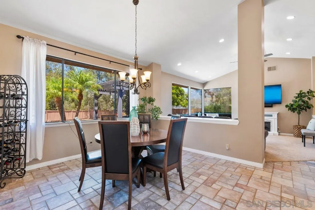 15735 Riparian Road Poway, CA 92064 - Photo 12 of 53 a view of a dining room with furniture window and outside view
