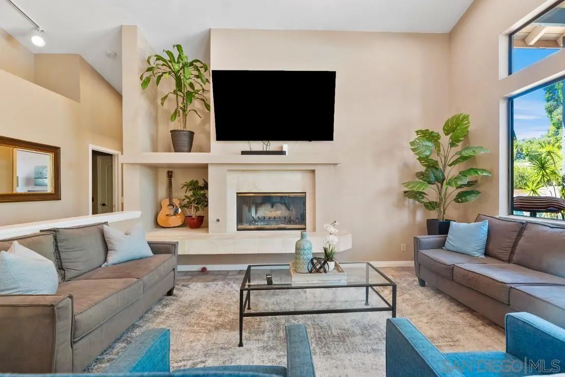 15735 Riparian Road Poway, CA 92064 - Photo 17 of 53 a living room with furniture and a flat screen tv