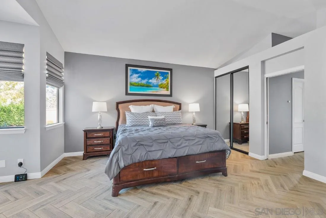 15735 Riparian Road Poway, CA 92064 - Photo 20 of 53 a bedroom with a bed and a painting on the wall