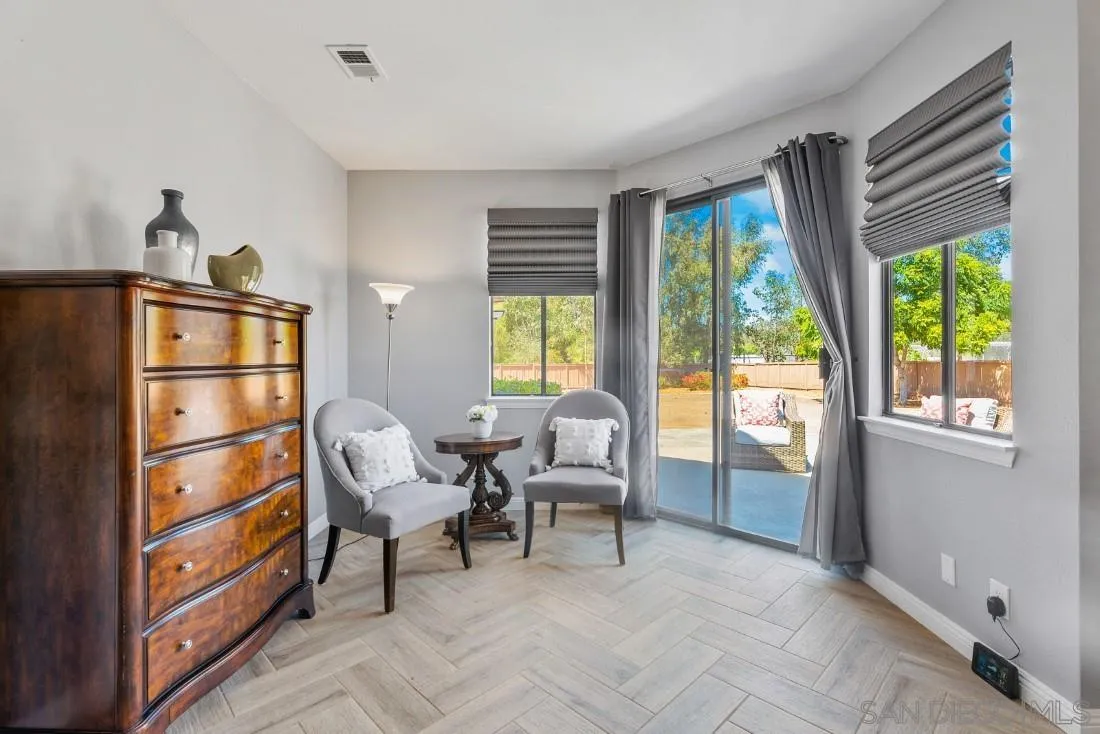 15735 Riparian Road Poway, CA 92064 - Photo 22 of 53 a living room with furniture and a window