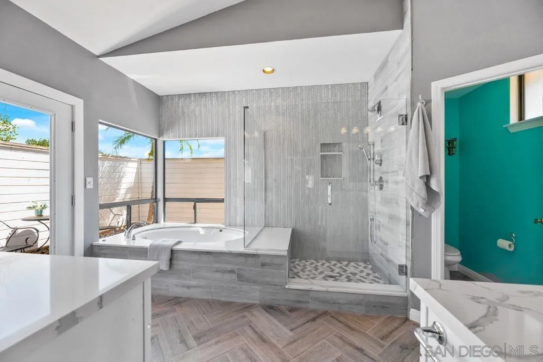 15735 Riparian Road Poway, CA 92064 - Photo 23 of 53 a large bathroom with a tub shower and sink