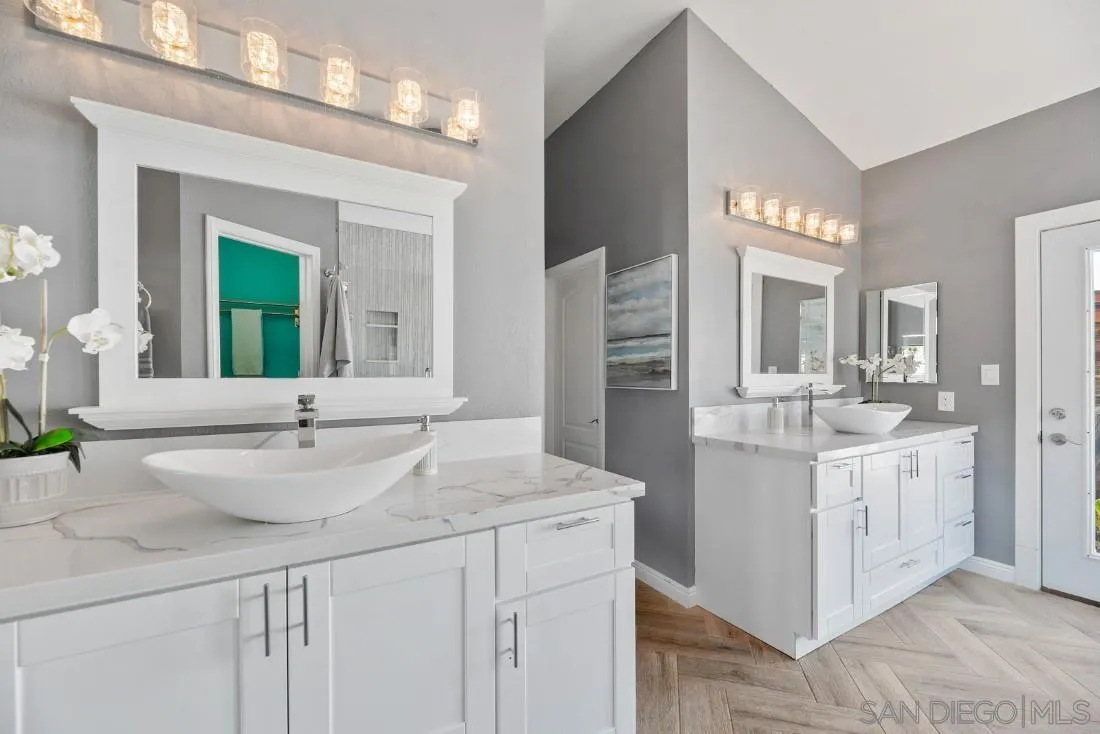 15735 Riparian Road Poway, CA 92064 - Photo 24 of 53 a bathroom with a sink double vanity and a mirror
