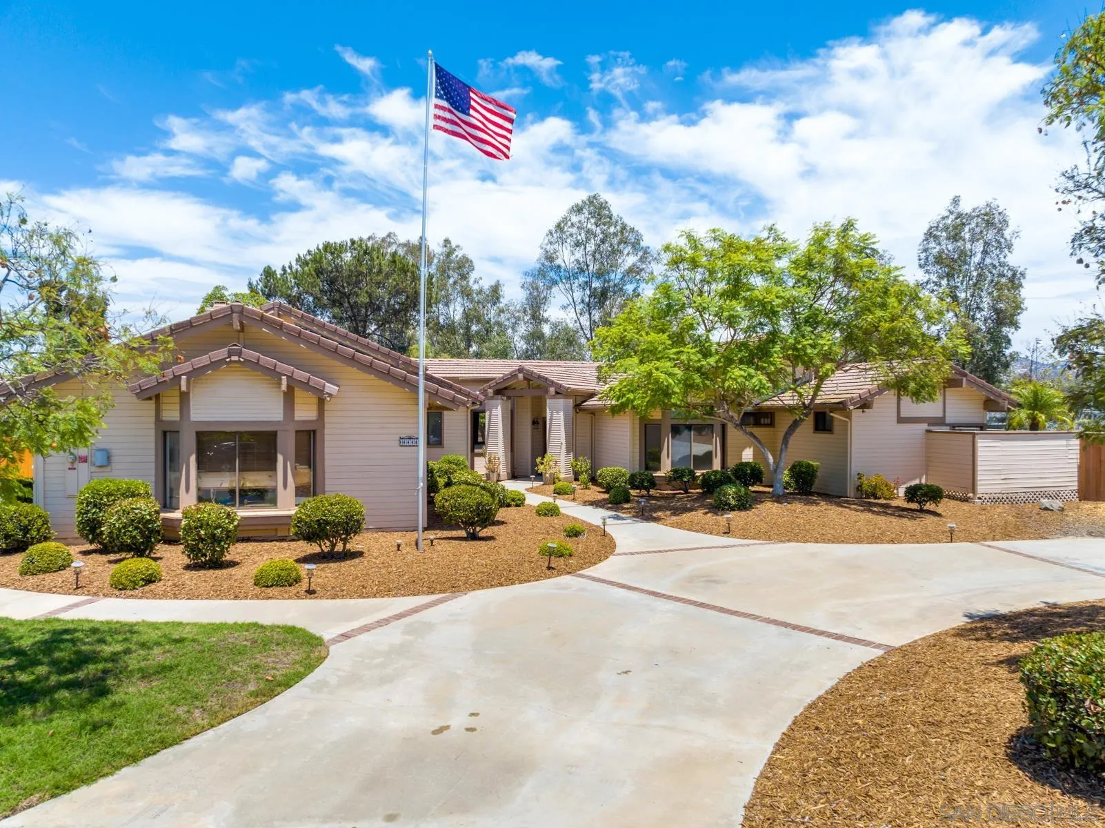 15735 Riparian Road Poway, CA 92064 - Photo 3 of 53 a row of palm trees in front of a house