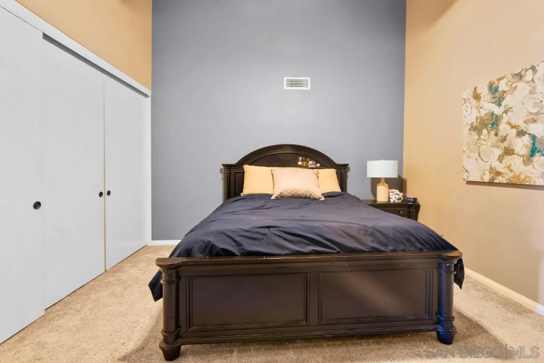 15735 Riparian Road Poway, CA 92064 - Photo 31 of 53 a bedroom with a bed and a window