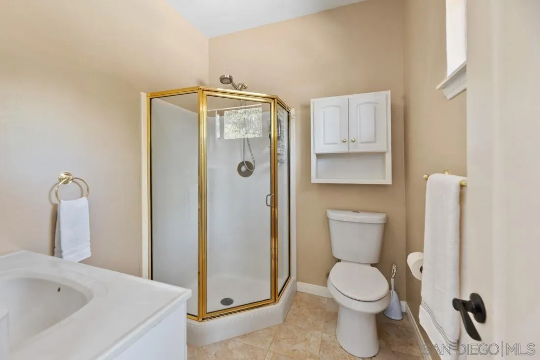 15735 Riparian Road Poway, CA 92064 - Photo 35 of 53 a bathroom with a toilet and a sink