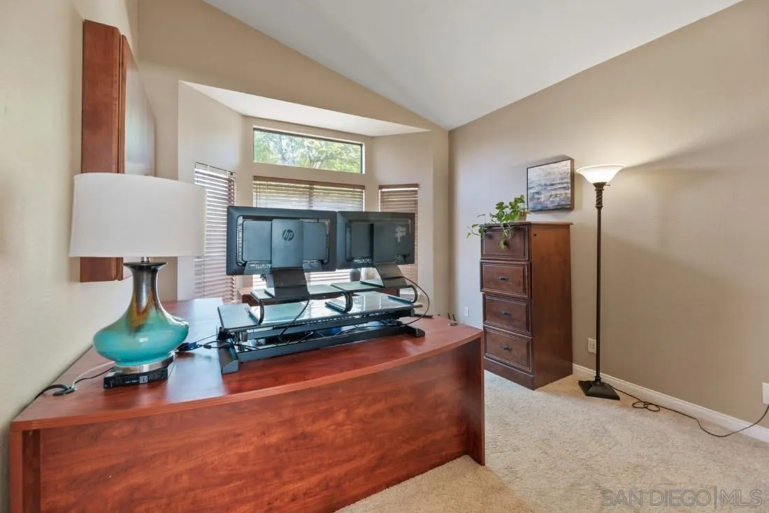 15735 Riparian Road Poway, CA 92064 - Photo 36 of 53 a living room with furniture a lamp and a table