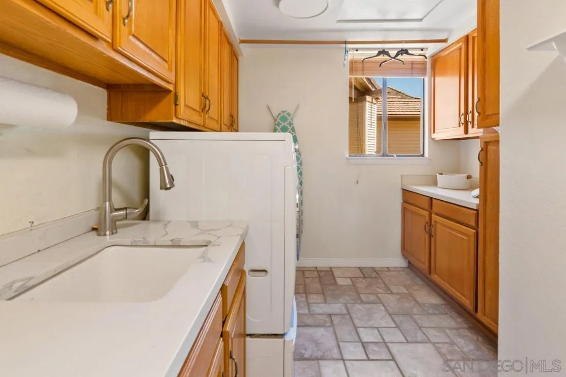 15735 Riparian Road Poway, CA 92064 - Photo 39 of 53 a bathroom with a sink a vanity and a mirror