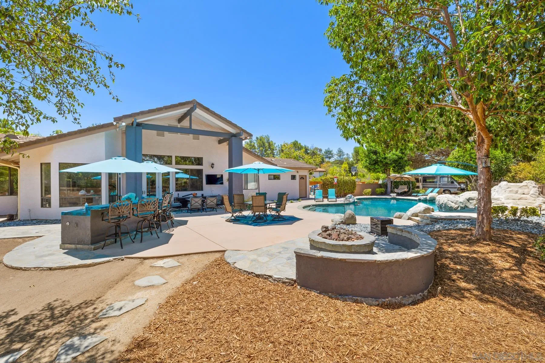 15735 Riparian Road Poway, CA 92064 - Photo 4 of 53 a view of a house with backyard and sitting area