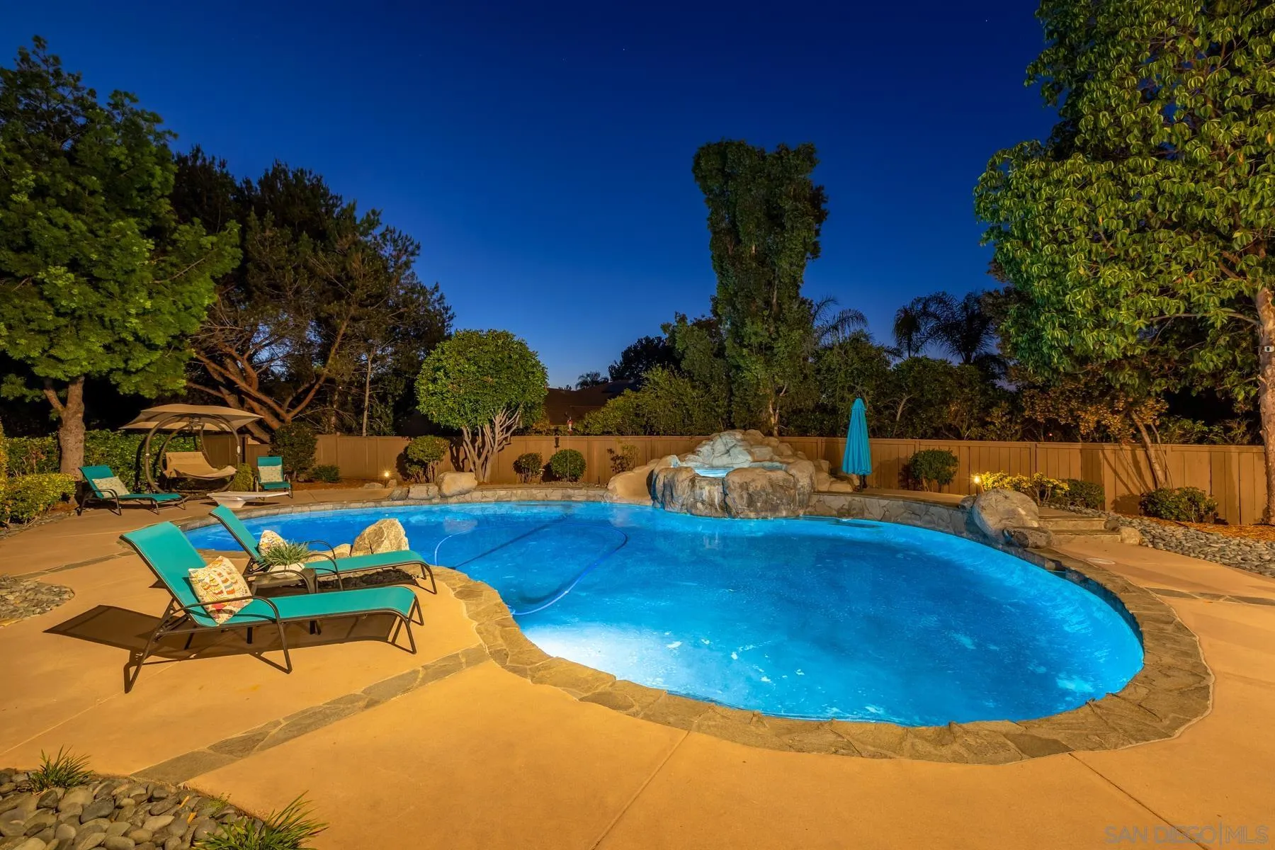15735 Riparian Road Poway, CA 92064 - Photo 46 of 53 a view of a swimming pool with an outdoor seating