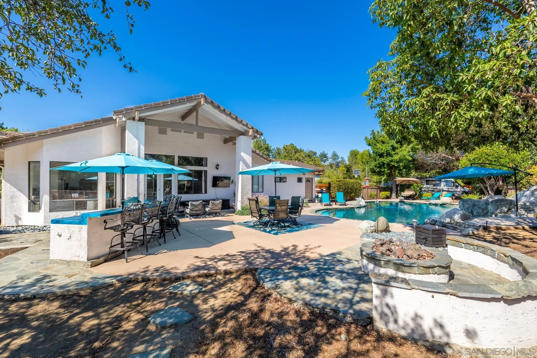 15735 Riparian Road Poway, CA 92064 - Photo 47 of 53 a view of a house with backyard porch and sitting area