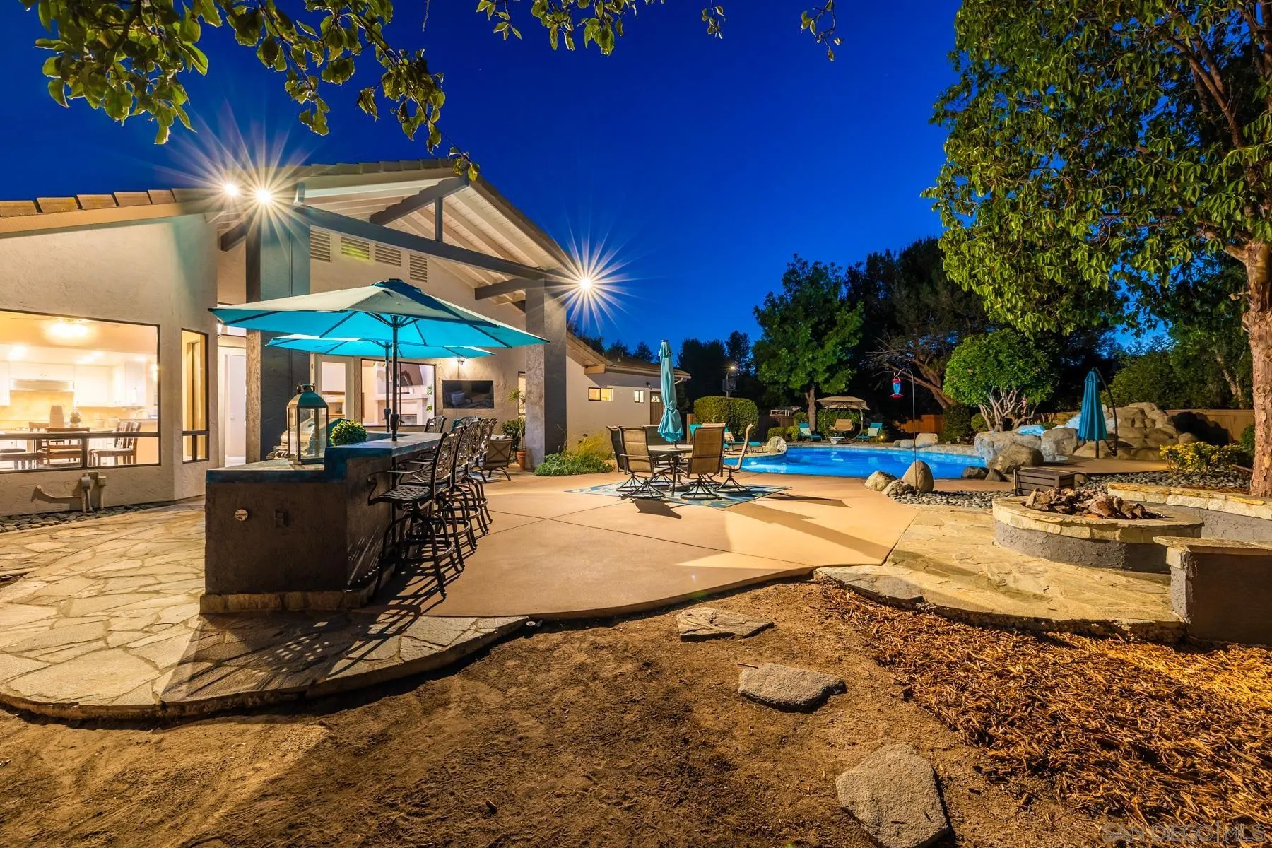 15735 Riparian Road Poway, CA 92064 - Photo 48 of 53 a view of a swimming pool with outdoor seating